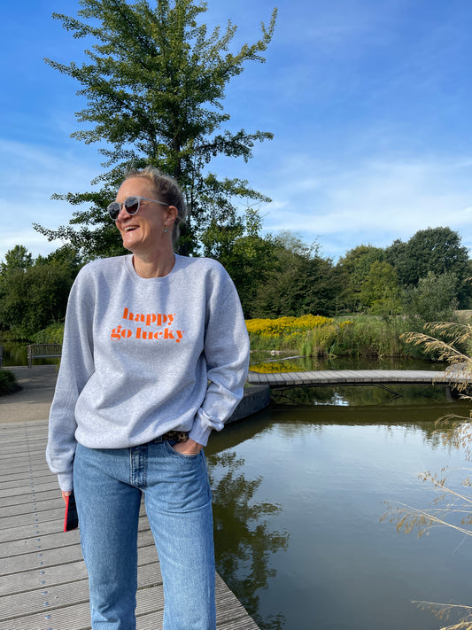 STRANDLIV Sweater "happy go lucky" grau/orange